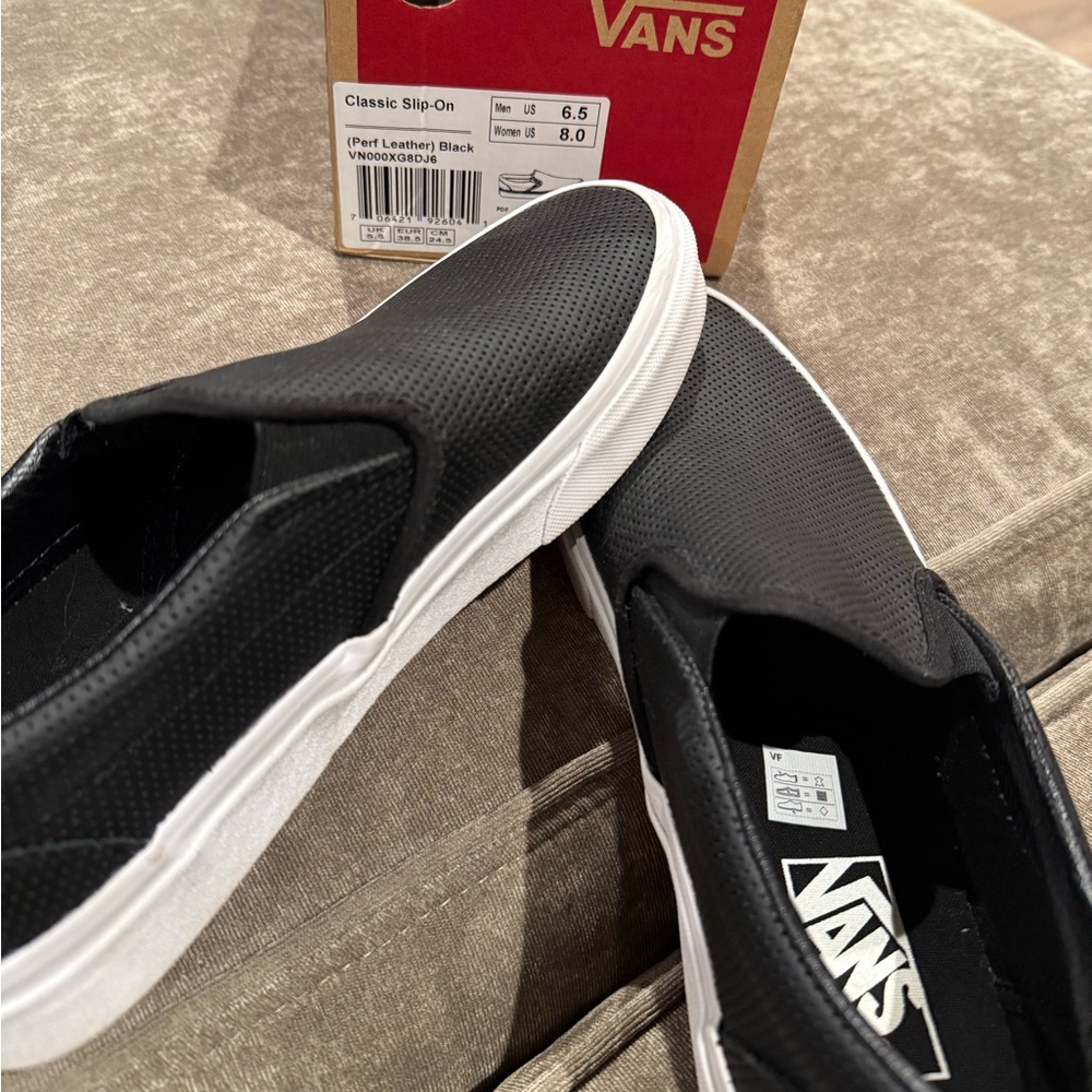 Perf leather black van slip ons